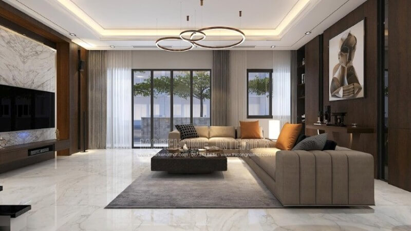 Nếu là người ưa thích sự nhẹ nhàng, một không gian sử dụng gam màu gỗ từ tấm ốp tường cùng màu nâu ghi bộ sofa góc. Bạn có thể tham khảo chi tiết mẫu trang trí biệt thự tại Park City hoặc đa dạng hơn nữa tại website:thietkenoithat.com Thiết kế nội thất biệt thự